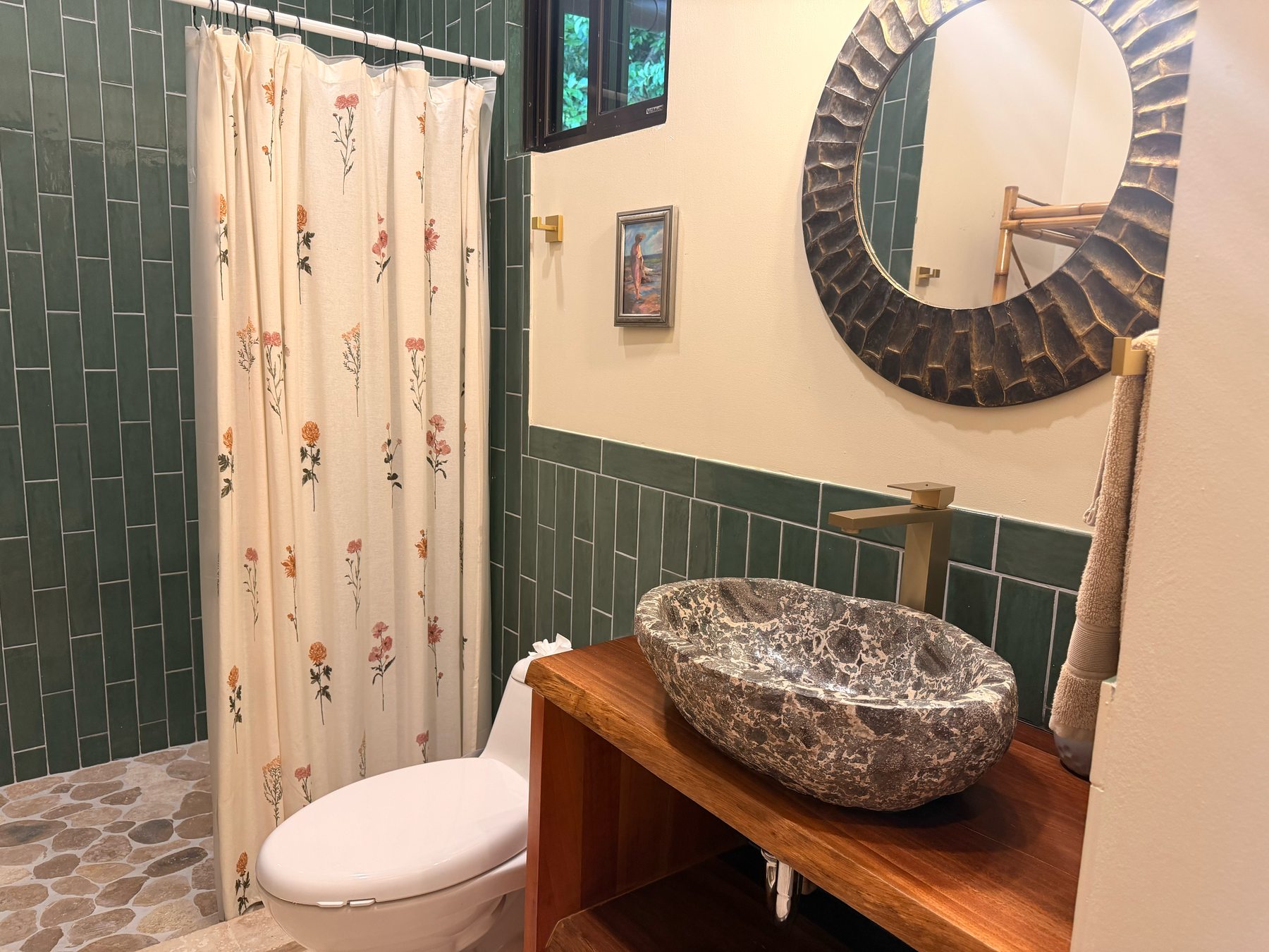 Green-tile bath with river-stone vessel sink