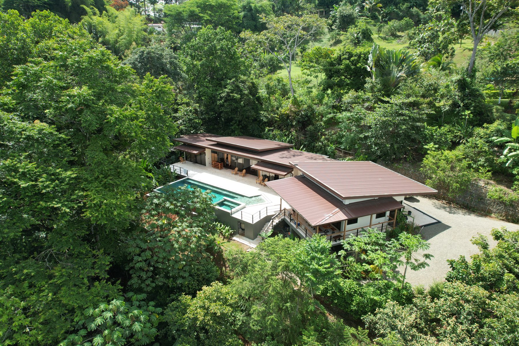 Aerial view of Casa Cavu surrounded by rainforest