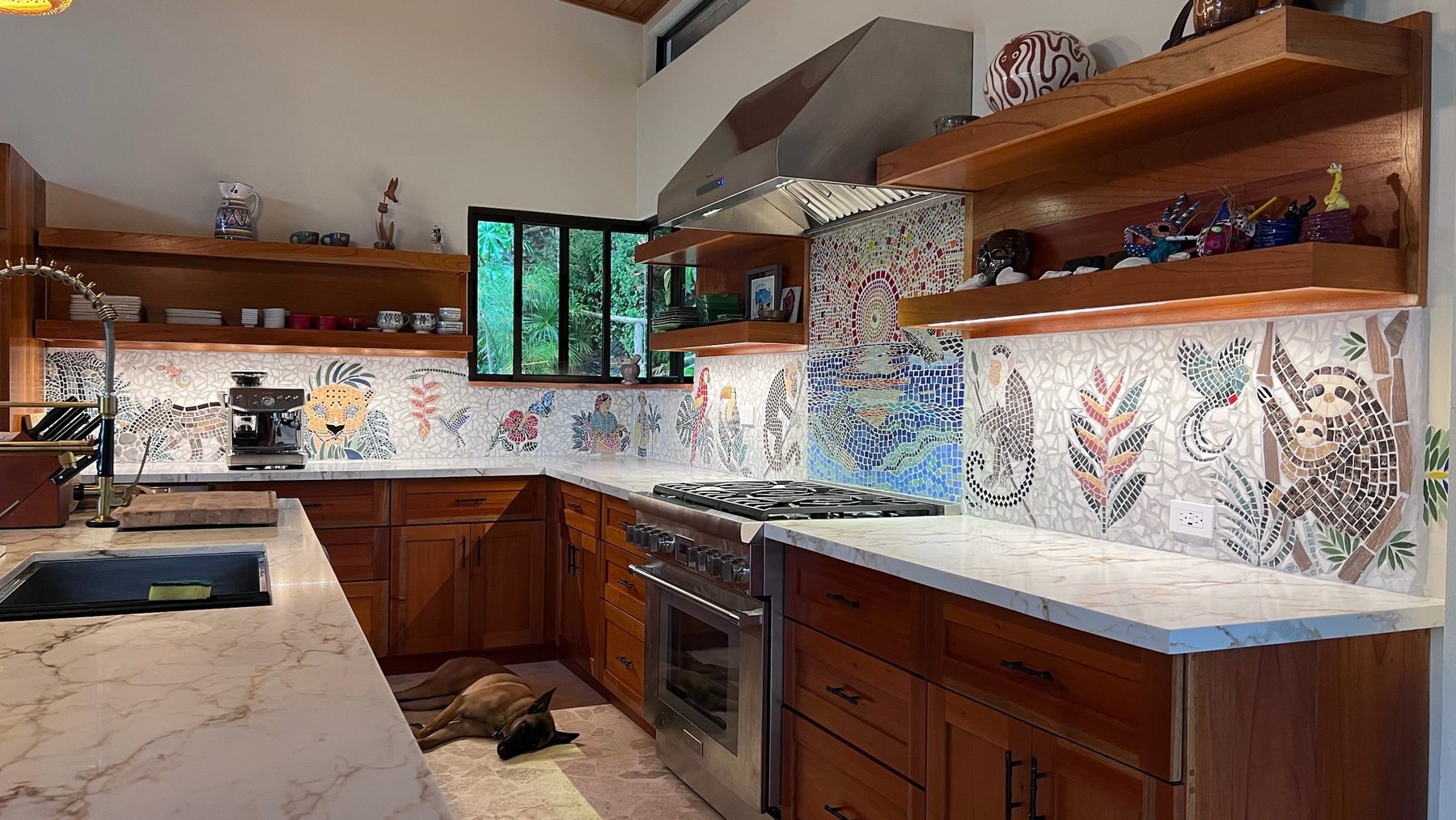 Full chef's kitchen with professional appliances and hand-cut mosaic backsplash