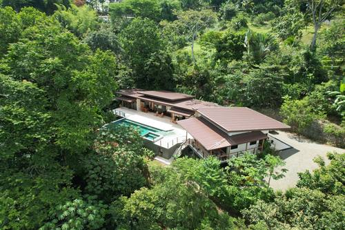Aerial view of Casa Cavu surrounded by rainforest