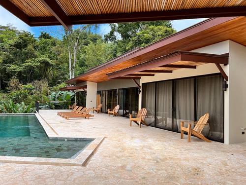 Raised spa spilling into the pool